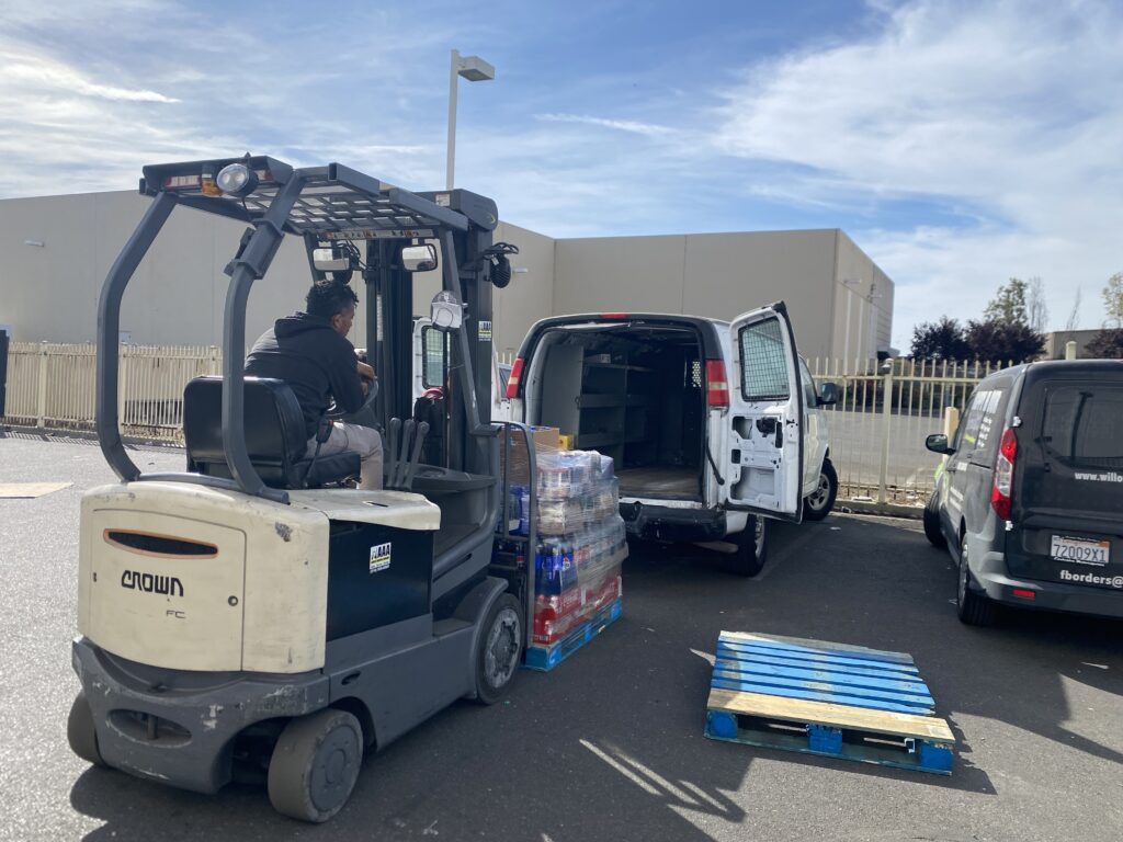 Al Eryani Wholesale logistics - forklift loading delivery vehicles