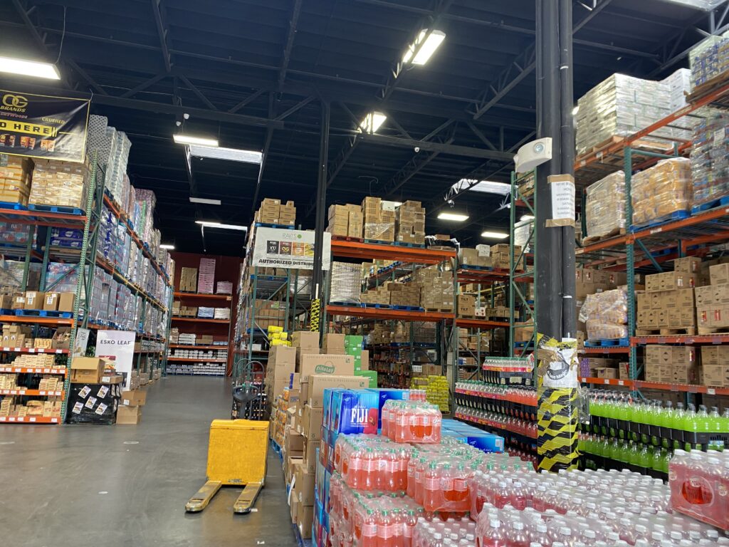 Wide warehouse floor with FIJI water and beverages