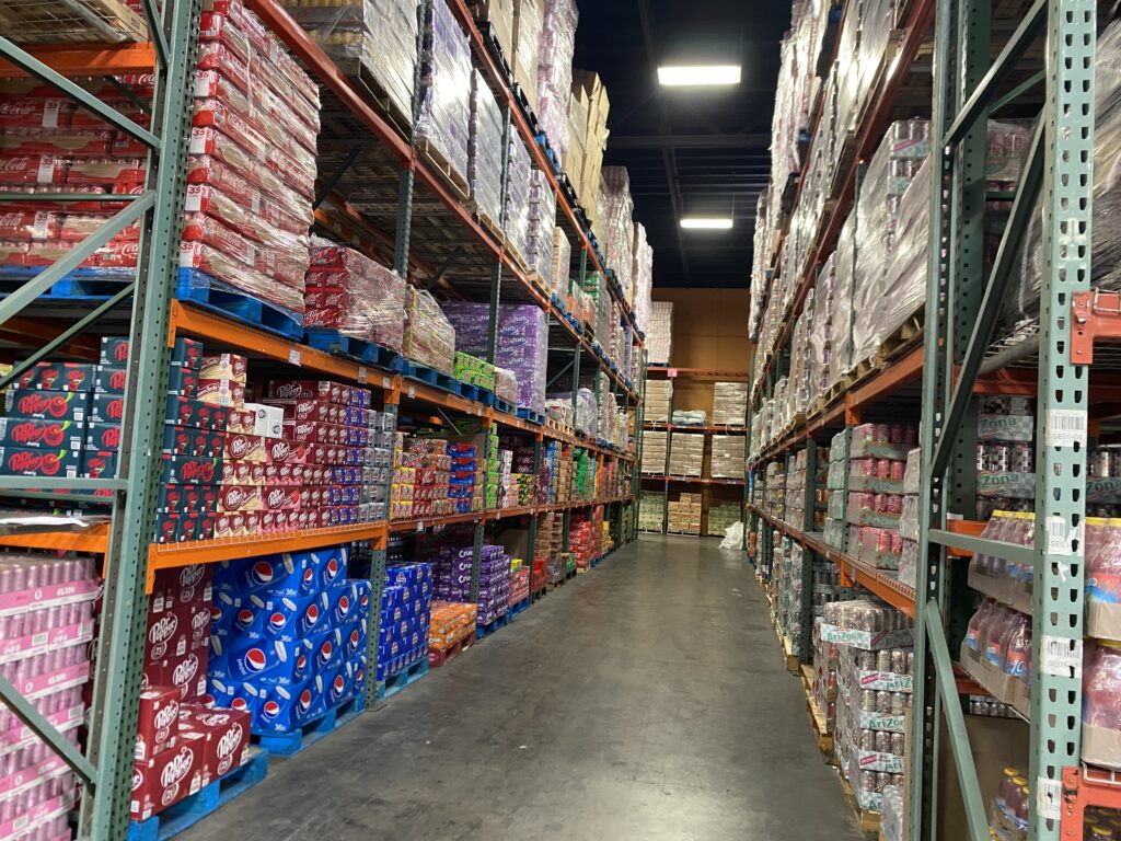Beverage aisle with Coca-Cola, Pepsi, and Arizona drinks